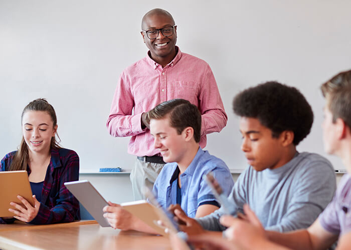 An educator teaching in front of the class
