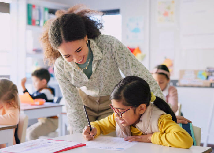 Teacher helping a student on work